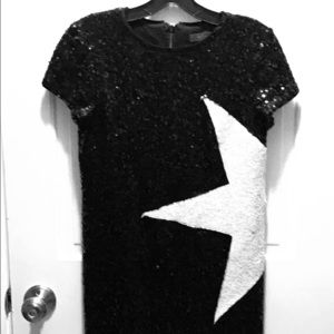 Black sequined dress with white star